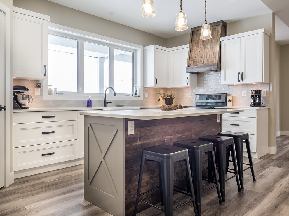 Large transitional u-shaped vinyl floor and multicolored floor eat-in kitchen photo in Edmonton with a double-bowl sink, recessed-panel cabinets, white cabinets, quartzite countertops, white backsplash, ceramic backsplash, stainless steel appliances and an island
