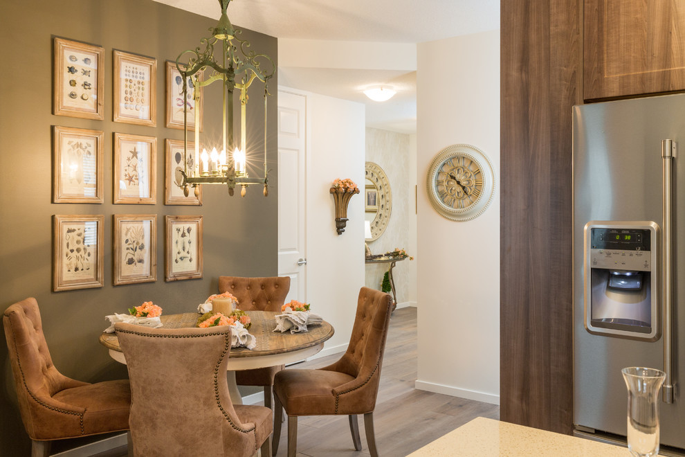 This is an example of a mid-sized traditional open plan dining in Calgary with white walls, dark hardwood floors and no fireplace.
