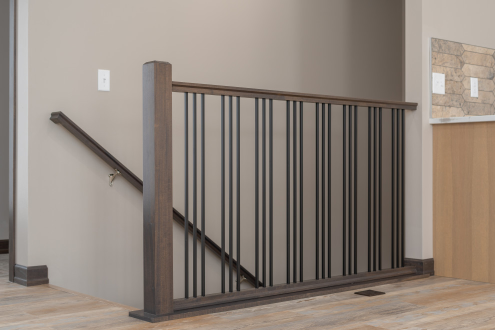 Transitional carpeted straight metal railing staircase photo with carpeted risers