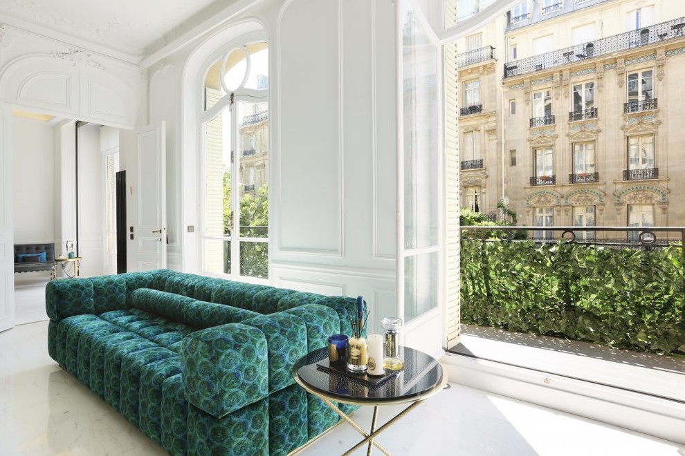 Design ideas for a large transitional open concept family room in Paris with white walls, marble floors and white floor.
