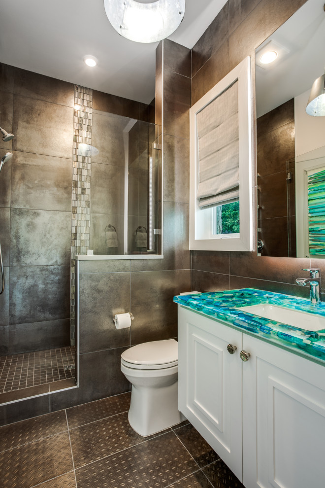 Inspiration for a mid-sized transitional kids bathroom in Dallas with shaker cabinets, white cabinets, an alcove shower, gray tile, porcelain tile, white walls, porcelain floors, an undermount sink, recycled glass benchtops, grey floor, a hinged shower door, blue benchtops, a single vanity, a built-in vanity and wallpaper.