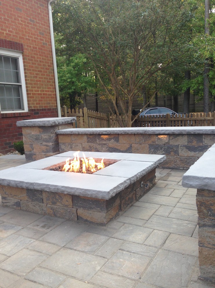 Inspiration for a small traditional backyard patio in Cincinnati with a fire feature, concrete pavers and no cover.
