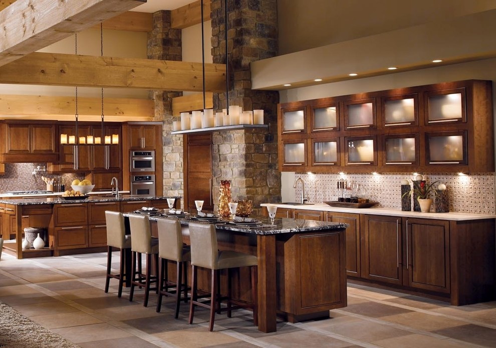 Example of a huge mountain style l-shaped terra-cotta tile and beige floor eat-in kitchen design in Miami with a double-bowl sink, glass-front cabinets, dark wood cabinets, quartz countertops, beige backsplash, stone tile backsplash, stainless steel appliances and an island