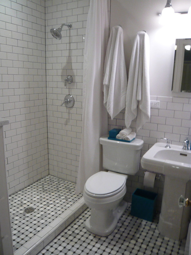 Photo of a small traditional 3/4 bathroom in Dallas with shaker cabinets, white cabinets, an open shower, a two-piece toilet, white tile, ceramic tile, white walls, marble floors, a pedestal sink and marble benchtops.