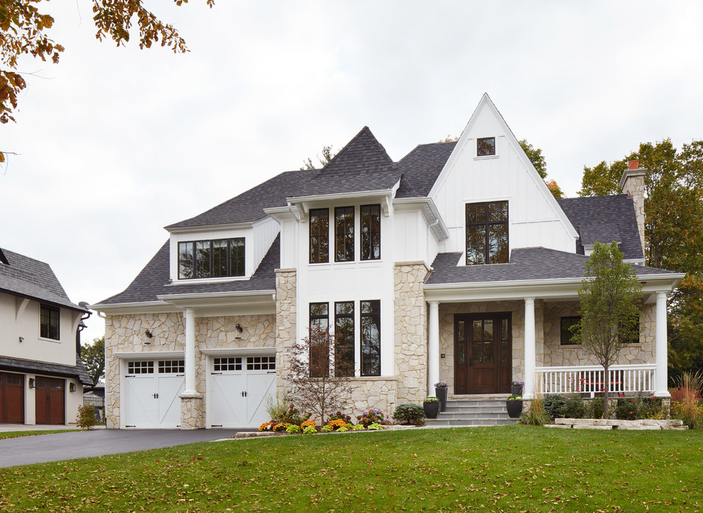 Large transitional three-storey white exterior in Chicago with a gable roof and mixed siding.