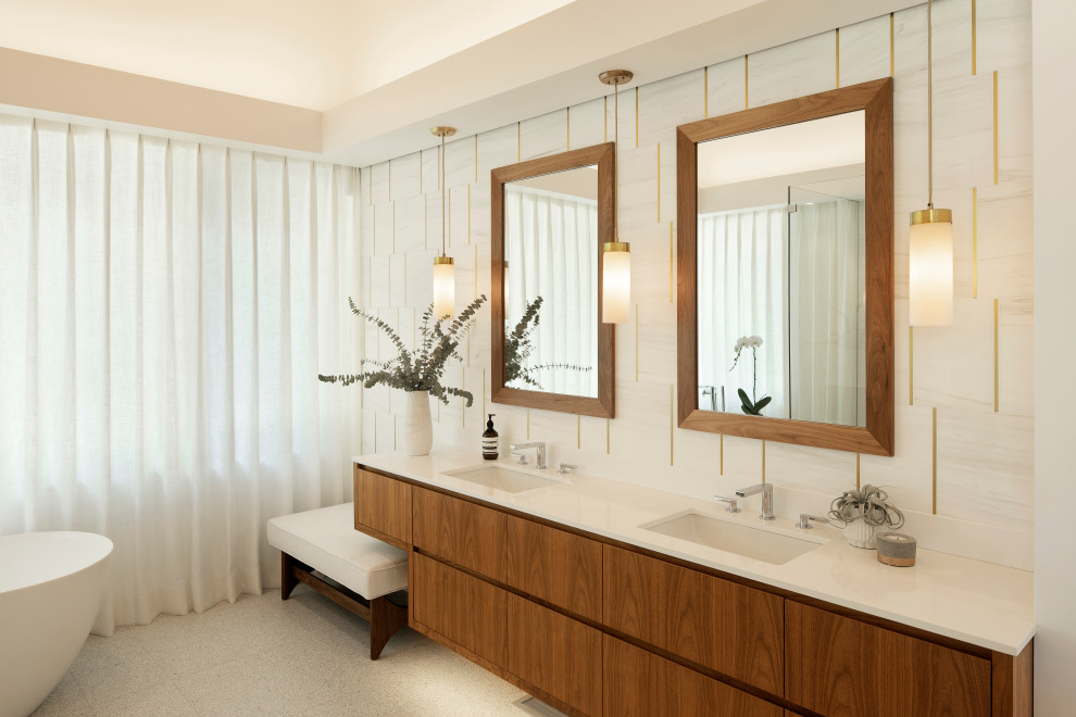 Photo of a large midcentury master bathroom in Portland with dark wood cabinets, a freestanding tub, a curbless shower, a wall-mount toilet, white tile, marble, white walls, terrazzo floors, an undermount sink, engineered quartz benchtops, white floor, a hinged shower door, white benchtops, an enclosed toilet, a double vanity, a floating vanity, vaulted and flat-panel cabinets.