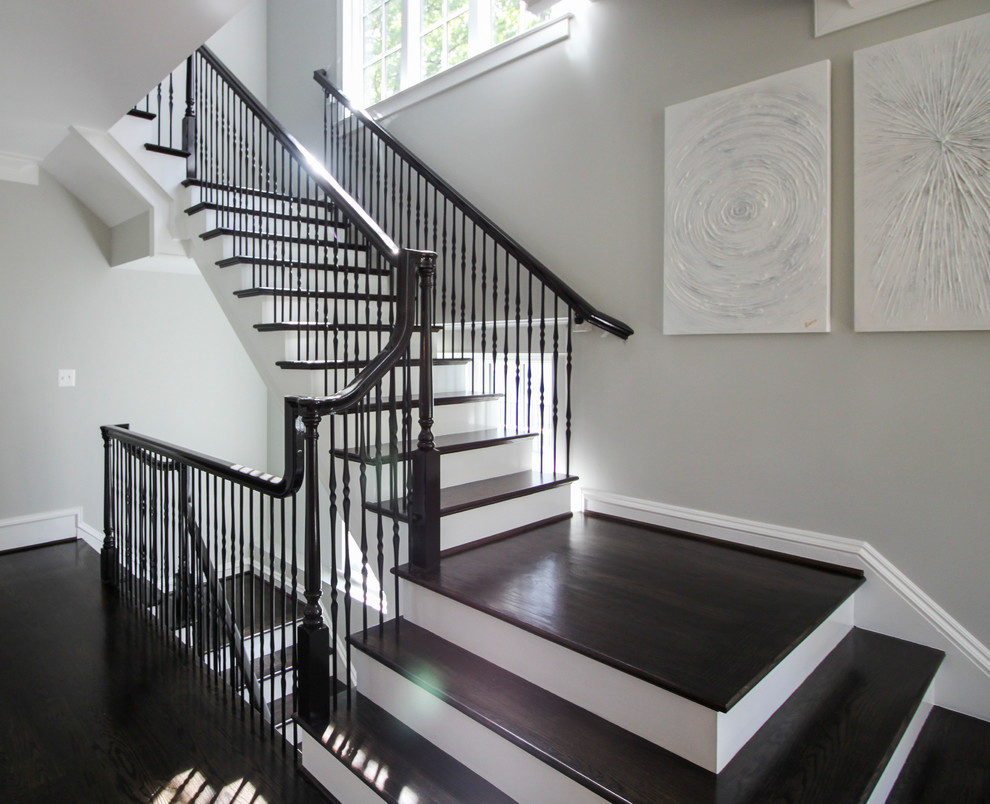 Large transitional wood floating staircase in DC Metro with wood risers and mixed railing.