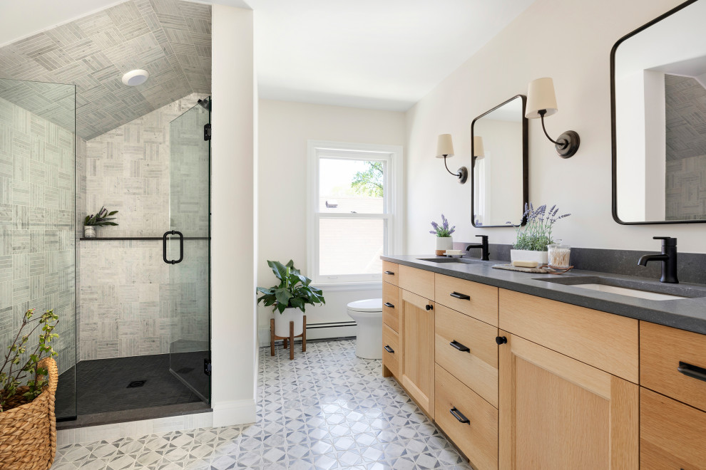 Inspiration for a transitional bathroom in Minneapolis with shaker cabinets, medium wood cabinets, beige walls, an undermount sink, multi-coloured floor, grey benchtops, a double vanity and a built-in vanity.