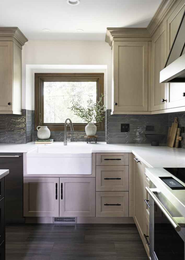 Eat-in kitchen - large transitional porcelain tile and gray floor eat-in kitchen idea in Chicago with a farmhouse sink, recessed-panel cabinets, light wood cabinets, quartz countertops, gray backsplash, porcelain backsplash, an island and white countertops