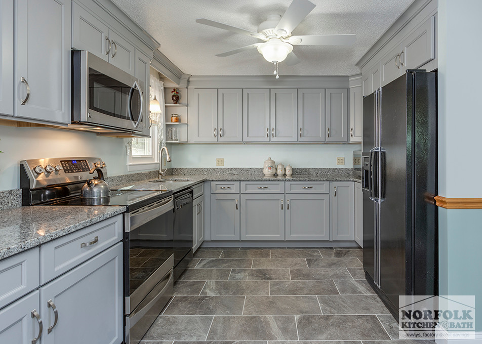 Home design - mid-sized transitional u-shaped home design idea in Boston with an undermount sink, shaker cabinets, gray cabinets, granite countertops, stainless steel appliances and no island