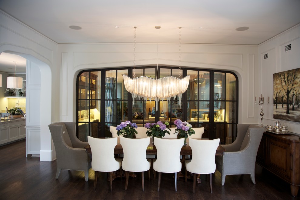 Inspiration for a contemporary dining room in Chicago with white walls and dark hardwood floors.