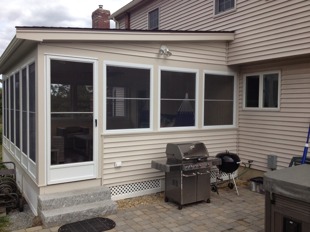 Inspiration for a classic back screened mixed railing veranda in Boston with decking and a roof extension.