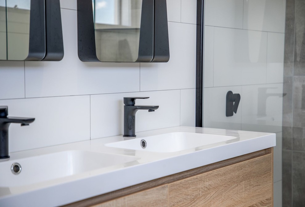 Small master bathroom with recessed-panel cabinets, light wood cabinets, a double shower, a one-piece toilet, white tile, ceramic tile, white walls, ceramic floors, an integrated sink, solid surface benchtops, grey floor, a hinged shower door and white benchtops.