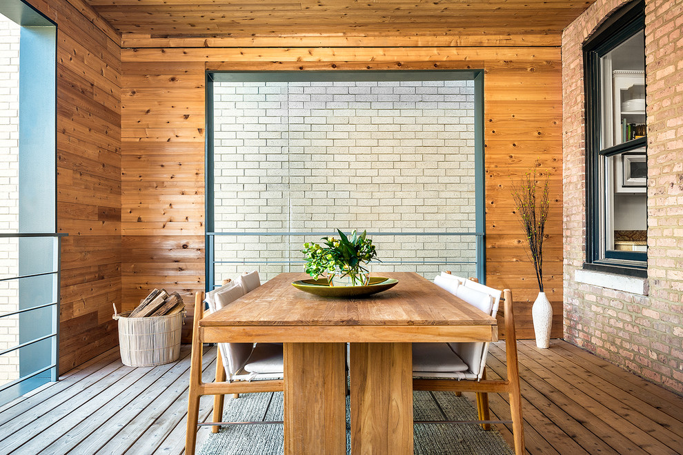 Beach style backyard deck photo in Chicago with a roof extension