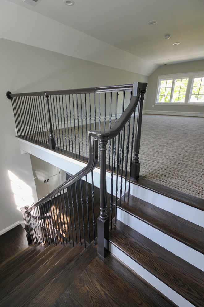 Example of a large transitional wooden l-shaped mixed material railing staircase design in DC Metro with painted risers