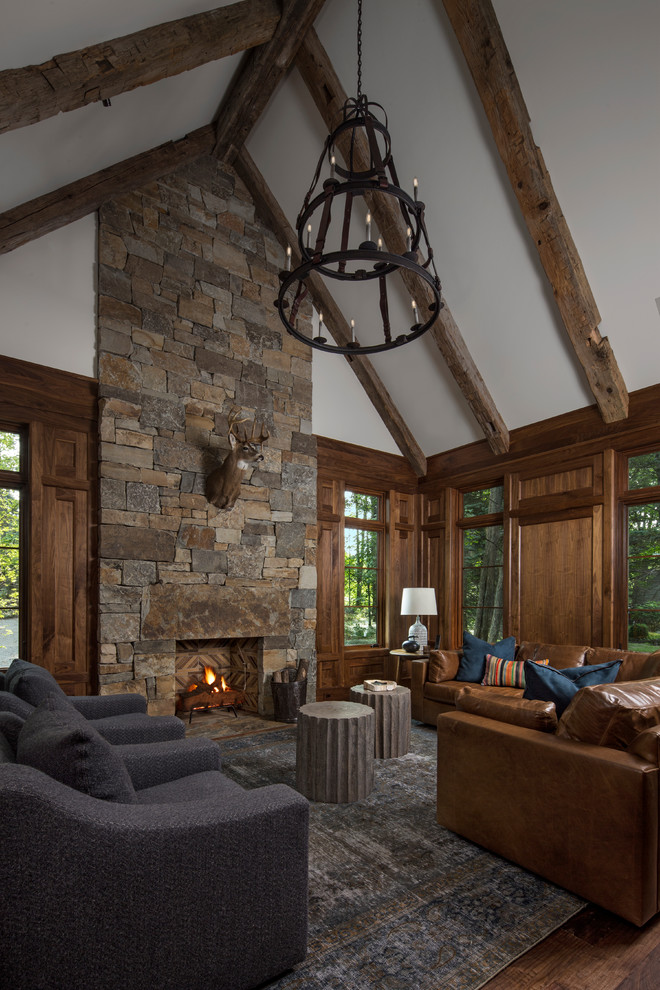 Transitional dark wood floor living room photo in Other with white walls, a standard fireplace and a stone fireplace
