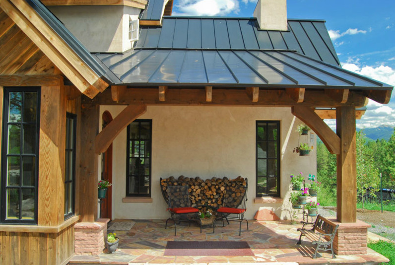 This is an example of a mid-sized traditional verandah in Denver.