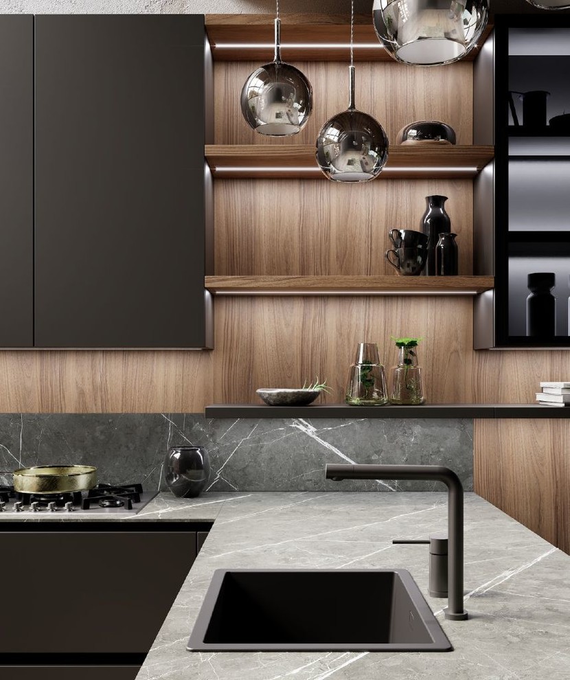 Photo of a mid-sized contemporary l-shaped open plan kitchen in San Francisco with a drop-in sink, flat-panel cabinets, black cabinets, quartz benchtops, brown splashback, timber splashback, panelled appliances, light hardwood floors, a peninsula, beige floor and grey benchtop.