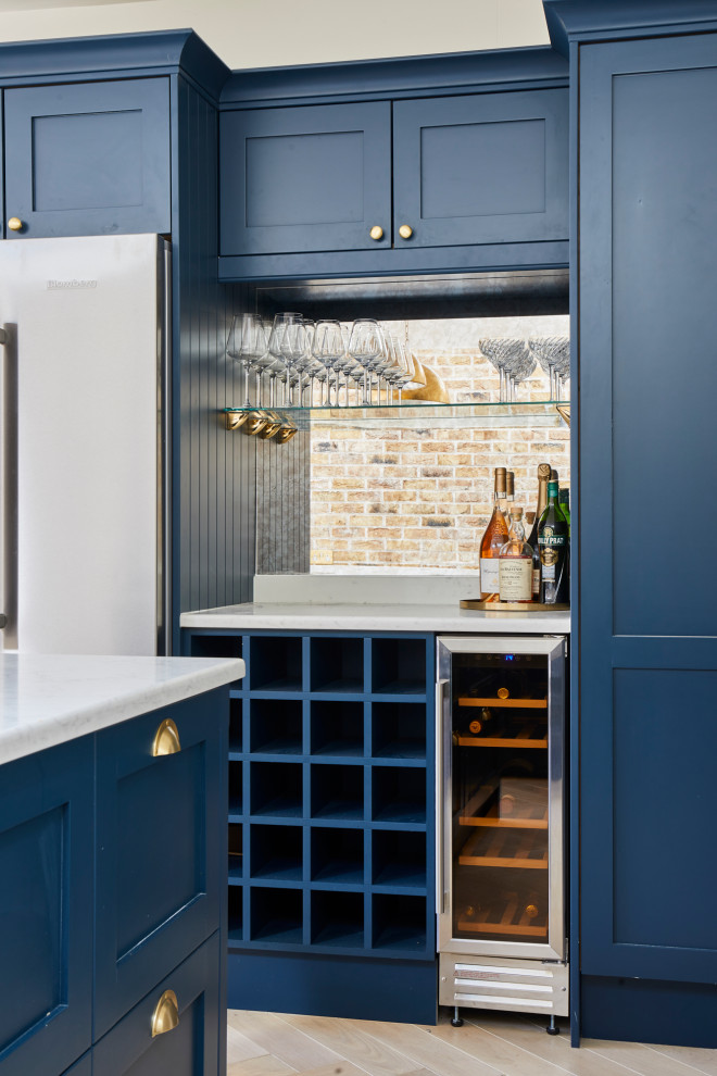 This is an example of a transitional home bar in London.