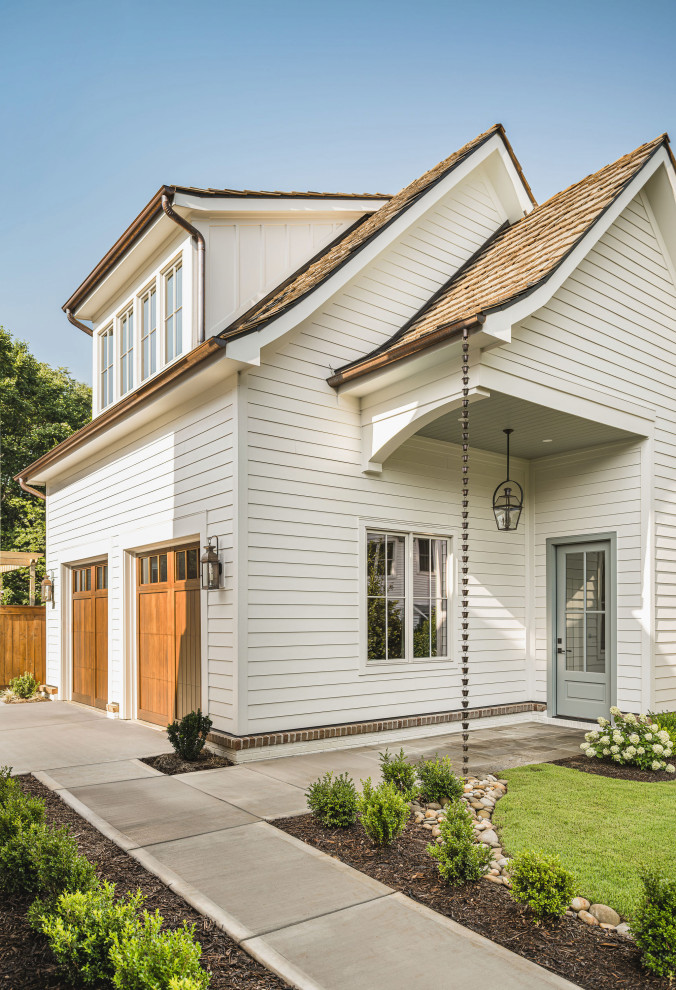 Cottage two-car garage photo in Charlotte