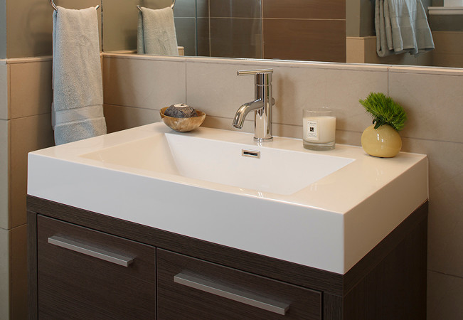 This is an example of a small contemporary 3/4 bathroom in San Francisco with an integrated sink, furniture-like cabinets, dark wood cabinets, beige tile and ceramic tile.
