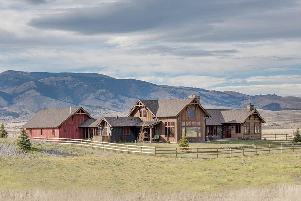 Inspiration for a rustic multicolored wood gable roof remodel with a mixed material roof
