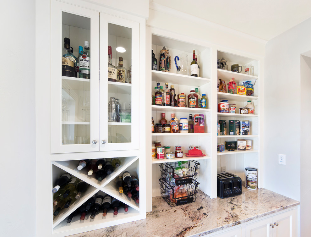 Mid-sized transitional galley light wood floor and brown floor enclosed kitchen photo with beaded inset cabinets, white cabinets, granite countertops, white backsplash, wood backsplash, stainless steel appliances and no island