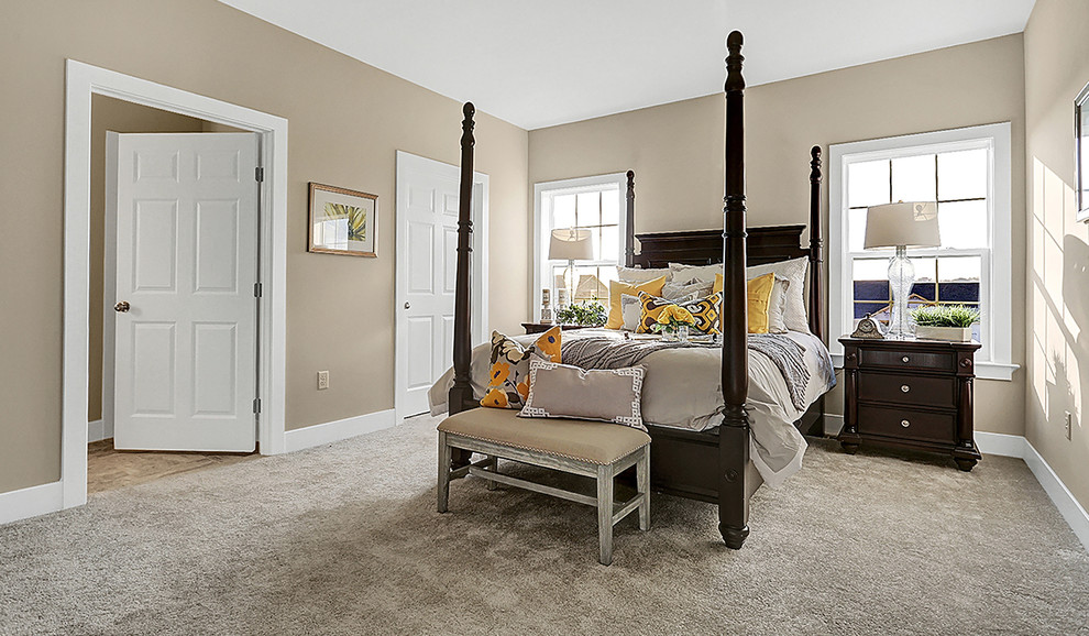 Photo of a mid-sized traditional master bedroom in Other with beige walls, carpet, no fireplace and beige floor.