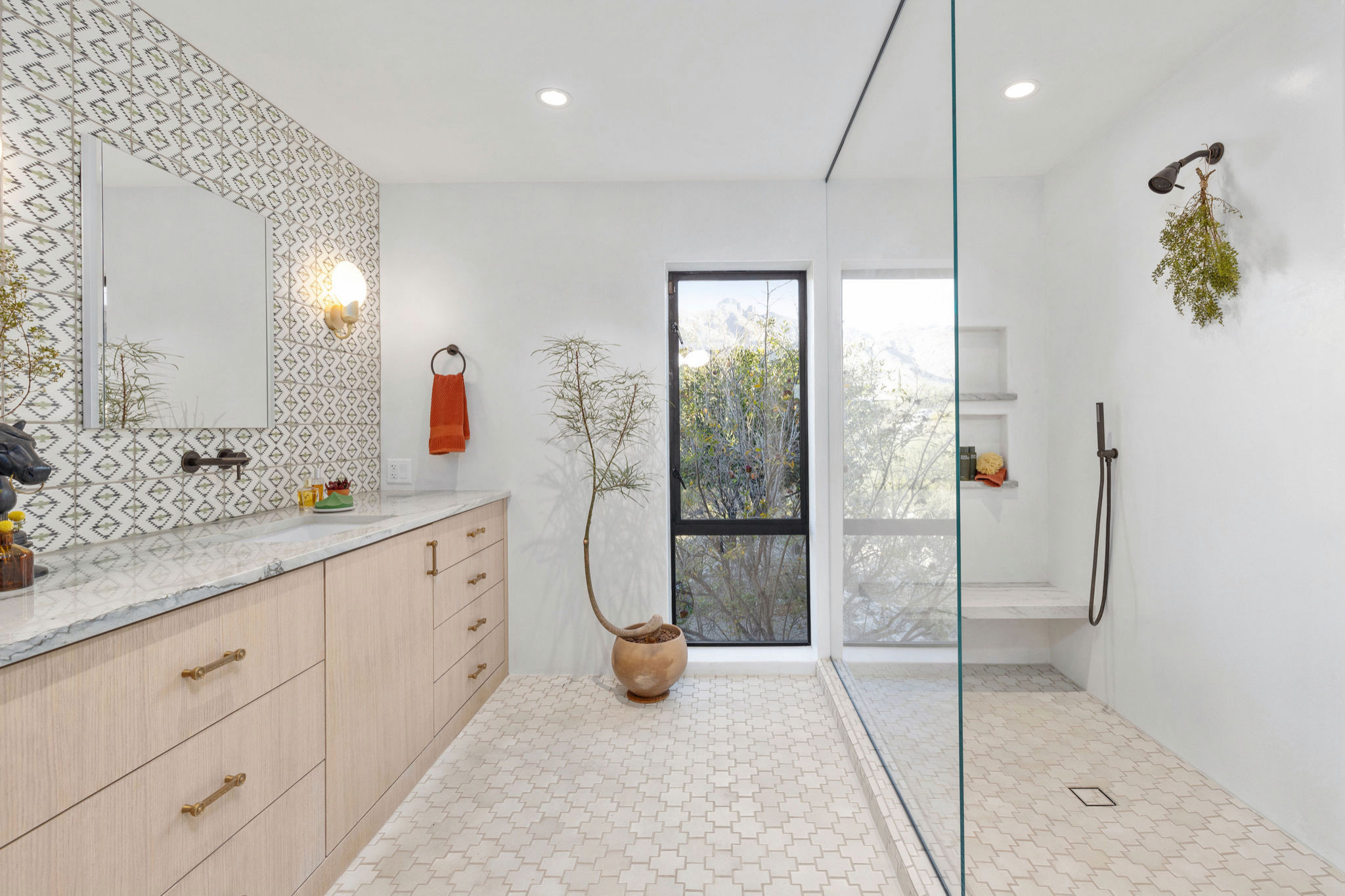 Inspiration for a southwestern master terra-cotta tile, white floor and double-sink shower bench remodel in Phoenix with flat-panel cabinets, light wood cabinets, white walls, quartzite countertops an