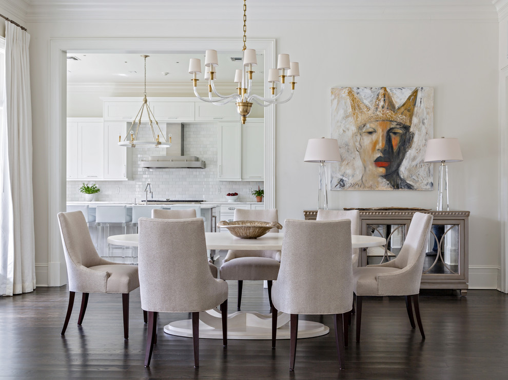 Mid-sized transitional dining room in New Orleans with white walls and dark hardwood floors.