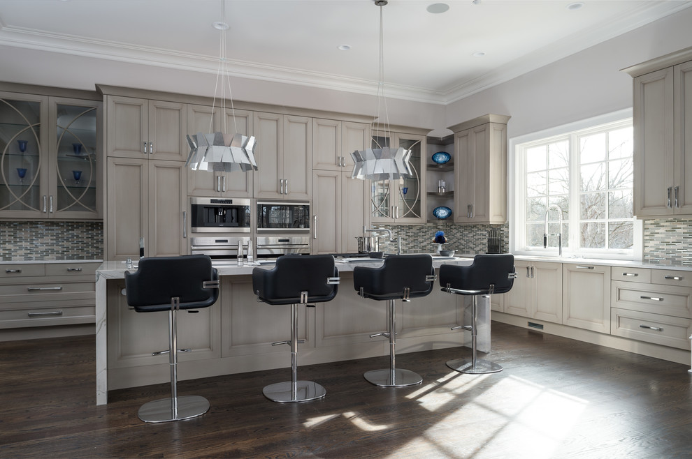 This is an example of a large contemporary l-shaped eat-in kitchen in Atlanta with recessed-panel cabinets, light wood cabinets, multi-coloured splashback, stainless steel appliances, dark hardwood floors and with island.