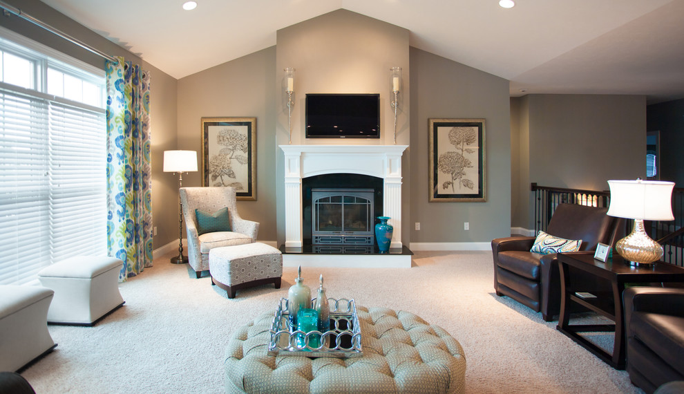 Photo of a mid-sized transitional formal open concept living room in Birmingham with beige walls, carpet, a standard fireplace, a tile fireplace surround, a wall-mounted tv and beige floor.