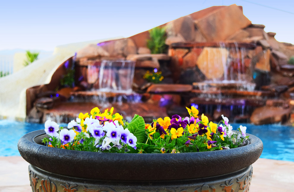 Example of a large transitional backyard concrete paver and custom-shaped pool fountain design in Phoenix
