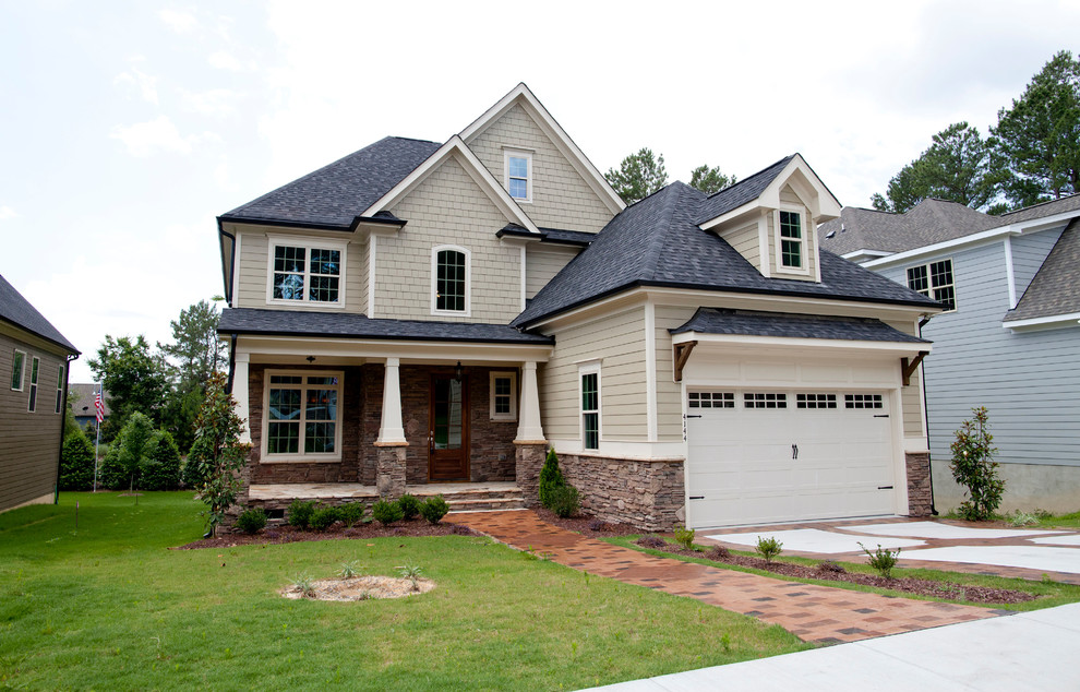 Mid-sized transitional two-storey exterior in Raleigh with vinyl siding.