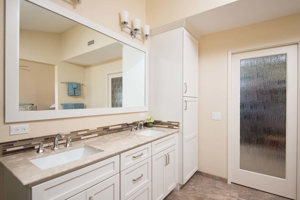Large contemporary master bathroom in San Diego with an undermount sink, shaker cabinets, white cabinets, marble benchtops, an alcove shower, a one-piece toilet, multi-coloured tile, porcelain tile, beige walls and porcelain floors.