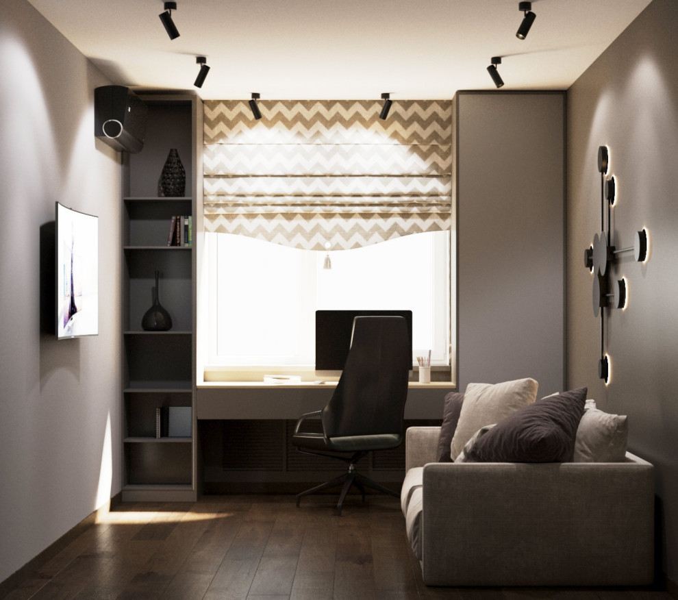Mittelgroßes Modernes Lesezimmer ohne Kamin mit grauer Wandfarbe, Laminat, freistehendem Schreibtisch, braunem Boden, eingelassener Decke und Tapetenwänden in Sonstige
