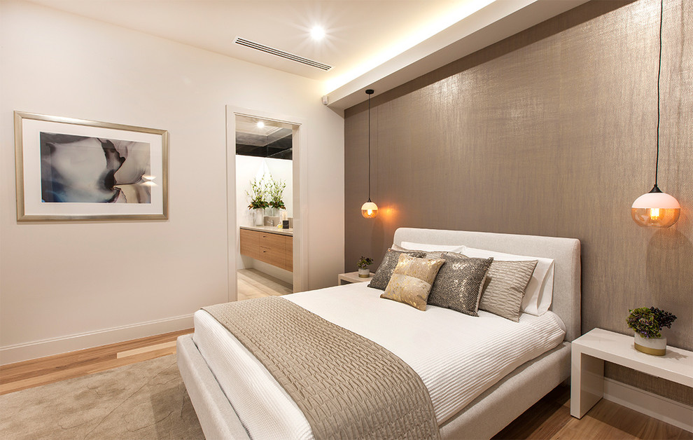 Photo of a contemporary bedroom in Adelaide with white walls, light hardwood floors and no fireplace.