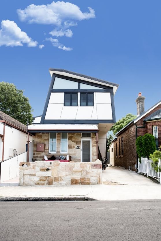 Mid-sized modern two-storey multi-coloured house exterior in Sydney with mixed siding.