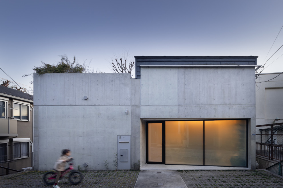 Design ideas for an industrial three-storey concrete exterior in Tokyo.