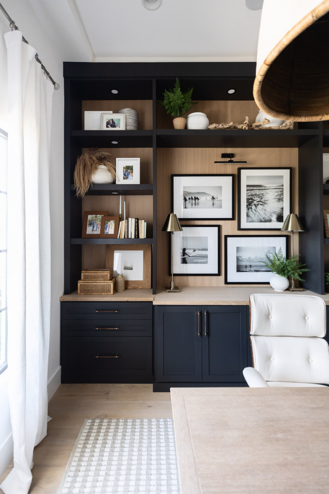 Study room - mid-sized coastal built-in desk coffered ceiling study room idea in Phoenix with white walls