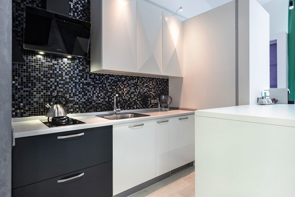 Design ideas for a small eclectic single-wall eat-in kitchen in Saint Petersburg with a drop-in sink, flat-panel cabinets, laminate benchtops, black splashback, mosaic tile splashback, black appliances, laminate floors, with island and grey floor.