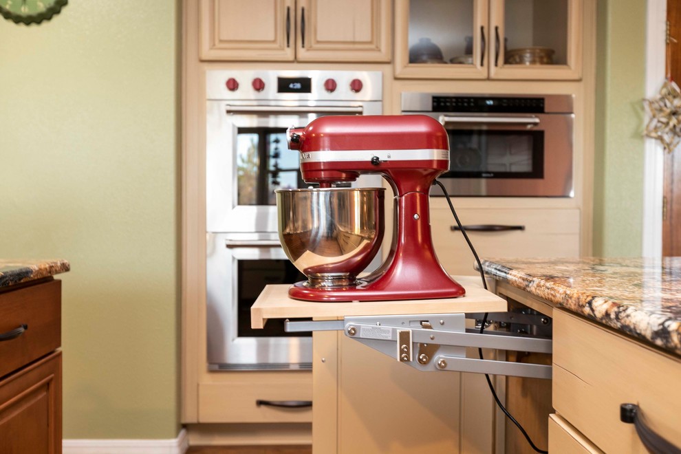 Design ideas for an expansive transitional u-shaped eat-in kitchen in Albuquerque with a drop-in sink, raised-panel cabinets, white cabinets, granite benchtops, multi-coloured splashback, stainless steel appliances, vinyl floors, with island, brown floor and multi-coloured benchtop.