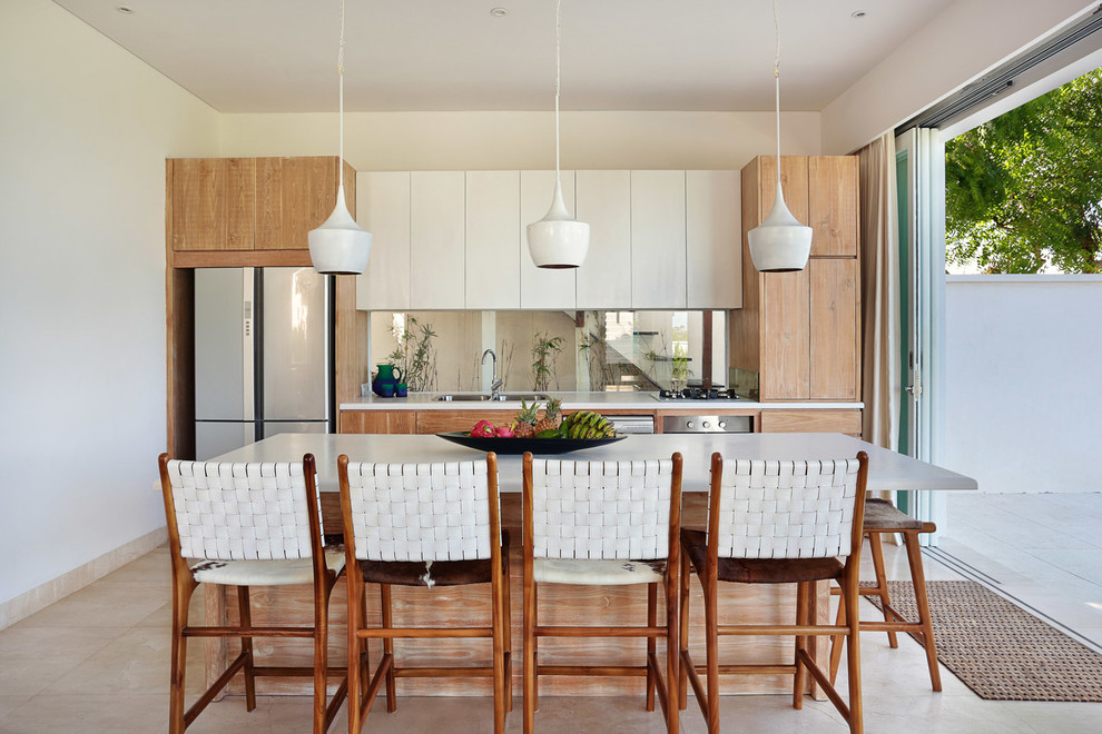 Mid-sized contemporary single-wall eat-in kitchen with a double-bowl sink, quartz benchtops, stainless steel appliances, marble floors, with island, flat-panel cabinets, white cabinets and glass sheet splashback.
