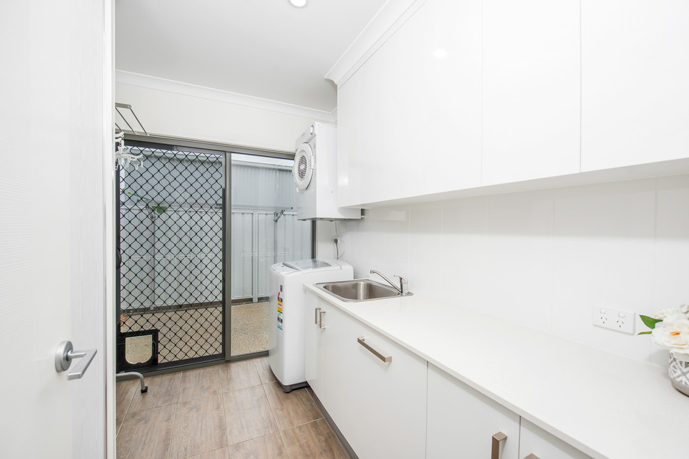 Photo of a contemporary laundry room in Sunshine Coast.