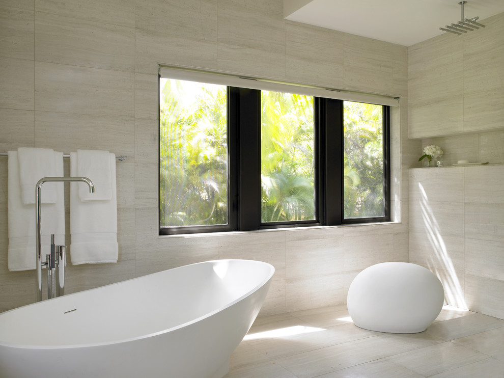 Design ideas for a contemporary bathroom in Miami with a freestanding tub.