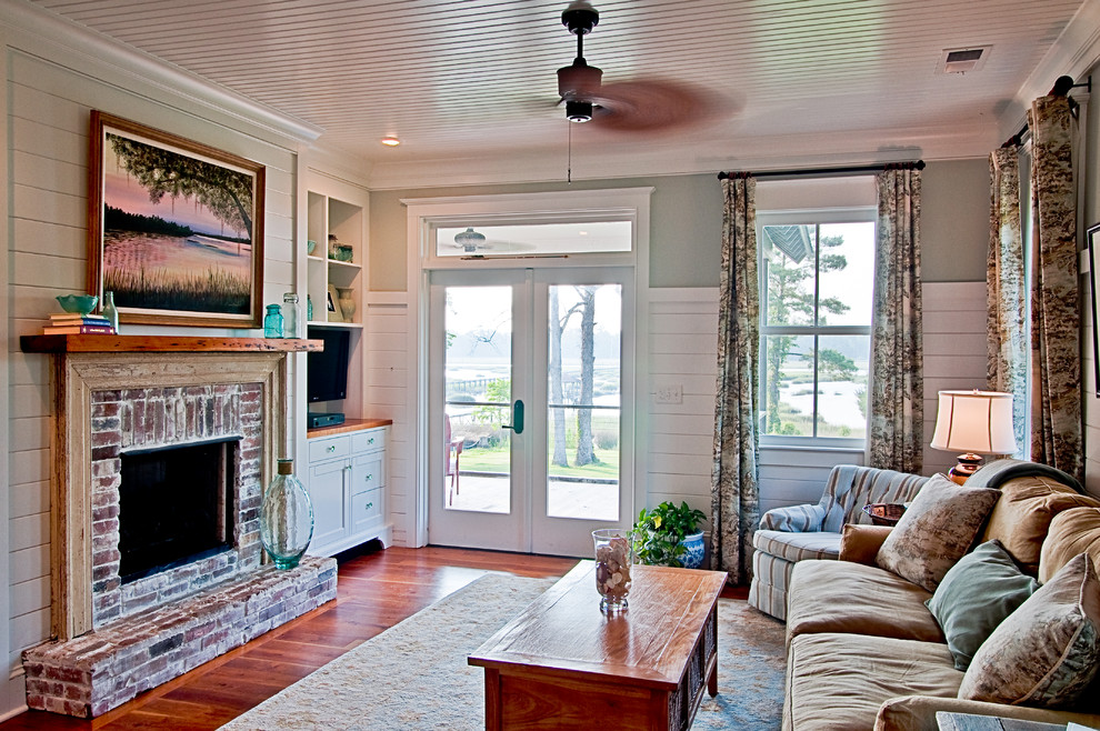 Example of a cottage living room design in Charleston
