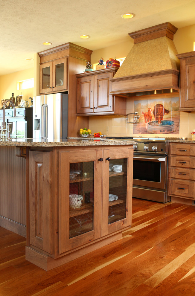 Design ideas for a country kitchen in Wichita with raised-panel cabinets and light wood cabinets.