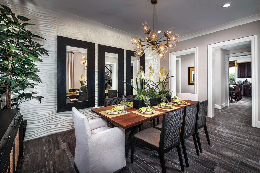 Large contemporary separate dining room in Los Angeles with grey walls, porcelain floors and no fireplace.