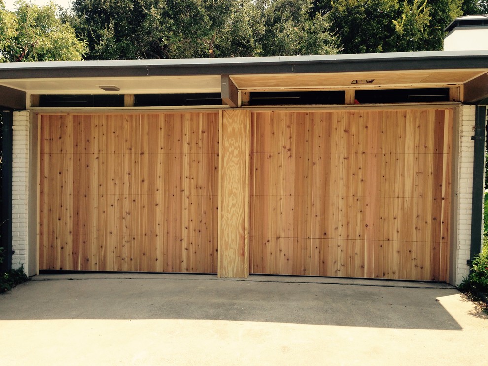 Example of a large classic attached two-car garage design in Dallas