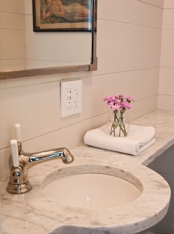 Example of a mid-sized classic 3/4 white tile and ceramic tile marble floor, gray floor, single-sink, wood ceiling and wood wall bathroom design in New York with open cabinets, white cabinets, a two-piece toilet, gray walls, an undermount sink, marble countertops, a hinged shower door, gray countertops and a freestanding vanity